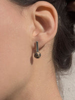 Load image into Gallery viewer, Quarry brass and stone Roos Earring, on model. Available at FAWN Toronto.
